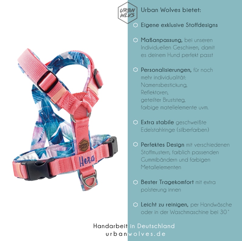 May include: A pink and blue dog harness with a floral pattern. The harness has a name tag that says "Hera". The harness is made with high-quality materials and features a sturdy design. It is adjustable and has a comfortable fit for your dog.