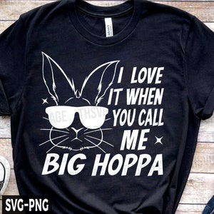 May include: Black t-shirt with a white graphic of a bunny wearing sunglasses and the text "I love it when you call me Big Hoppa".