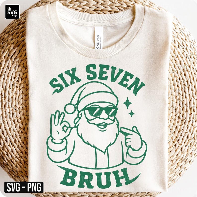 May include: Cream-colored t-shirt with a green graphic of Santa Claus wearing sunglasses and a hat, giving an 'okay' hand gesture. The text reads 'SIX SEVEN BRUH'.