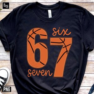 May include: Black t-shirt with a basketball-themed design. The design features the numbers "67" in orange, with a basketball texture, and the words "six" and "seven" in a script font.
