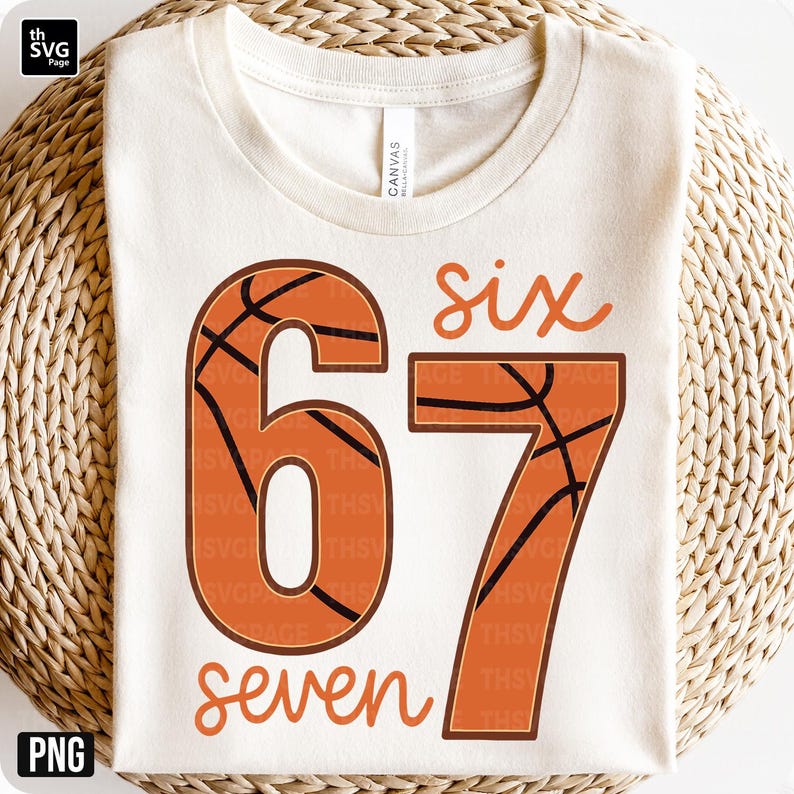 May include: Cream-colored t-shirt with the numbers "67" in orange, designed to resemble basketballs. The word "six" is above the "6" and "seven" is below the "7". The shirt is made of a soft material.