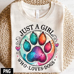 May include: A white t-shirt with a watercolor paw print design and the text "Just a girl who loves dogs".