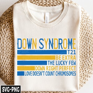 May include: A white t-shirt with the text "DOWN SYNDROME T21" in blue and yellow. The text is in a striped pattern with the words "BE EXTRA", "THE LUCKY FEW", "DOWN RIGHT PERFECT", and "LOVE DOESN'T COUNT CHROMOSOMES" below it.