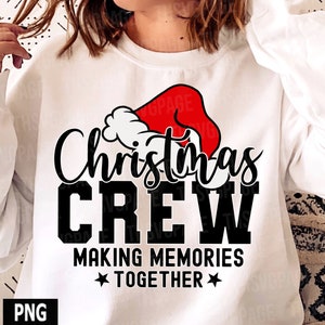 May include: White sweatshirt with a black and red graphic that says "Christmas Crew Making Memories Together" with a Santa hat graphic.
