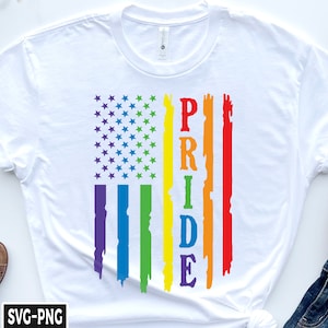 May include: White t-shirt with a rainbow-colored American flag design and the word "PRIDE" written vertically in the center.