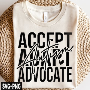 May include: A white t-shirt with the text "ACCEPT AUTISM ADVOCATE" printed in black. The word "AUTISM" is written in a stylized script font.