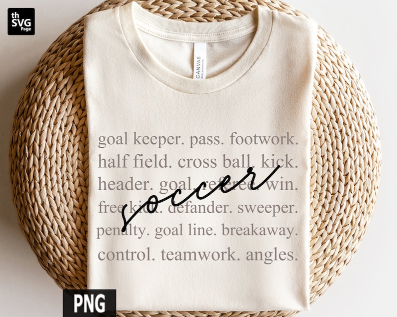 May include: A beige t-shirt with the word "soccer" written in black cursive script. The text is surrounded by a list of soccer terms, including "goal keeper", "pass", "footwork", "half field", "cross ball", "kick", "header", "goal", "win", "free kick", "defender", "sweeper", "penalty", "goal line", "breakaway", "control", "teamwork", and "angles".