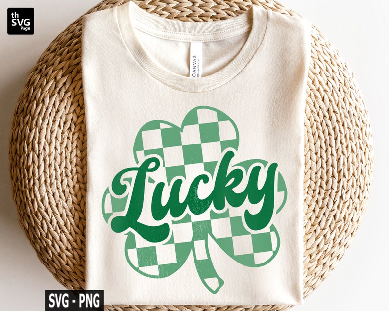 May include: A white t-shirt with a green checkered shamrock and the word "Lucky" in green text.