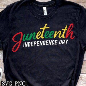 May include: Black t-shirt with the words "Juneteenth Independence Day" in red, green, yellow, and white. The shirt is made of a soft material and has a classic crew neck design. A casual and comfortable tee for celebrating Juneteenth.