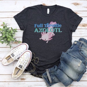May include: A dark grey t-shirt featuring a pink axolotl illustration and the text "Full Throttle Axolotl" in blue and teal lettering.