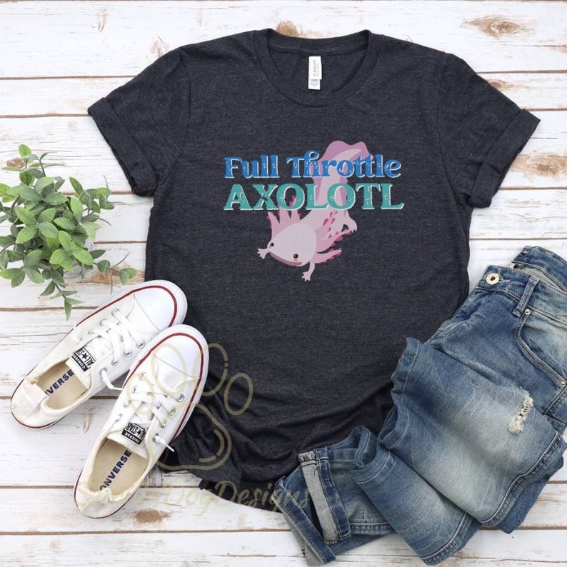 May include: A dark grey t-shirt featuring a pink axolotl illustration and the text "Full Throttle Axolotl" in blue and teal lettering.