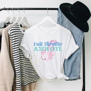 May include: White t-shirt featuring a pink axolotl illustration and the text "Full Throttle Axolotl" in blue and teal.