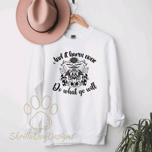 May include: White sweatshirt with a black and white graphic of a moth, a pentagram, and mushrooms. The text "And it harm none Do what ye will" is printed on the sweatshirt.