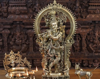 Brass Manmohaka Murlidhara (Lord Krishna) Playing Flute on an Elephant Yaksha Pedestal - Made in Tanjhavur, South India - Only at Dharma
