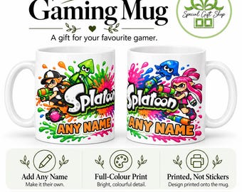 May include: Two white ceramic mugs featuring colourful Splatoon character graphics, ink splatters, and the text "ANY NAME" in orange. The mugs display cartoon figures holding ink blasters, surrounded by vibrant green, blue, and pink paint splashes.