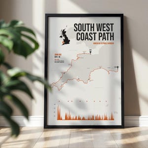 May include: A framed wall art print featuring a map of the South West Coast Path from Minehead to Poole Harbour. The design includes a small map of Great Britain, a detailed route line, elevation data, and text reading South West Coast Path.