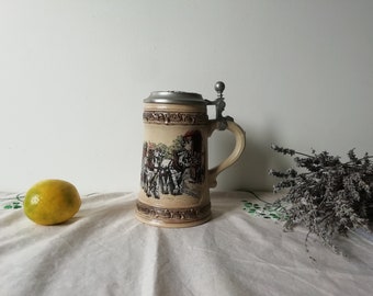 Vintage beer stein beige ceramic. 94% Zinn lidded drinking mug bas-relief with horses in a rustic setting from Germany. Unique gift for him