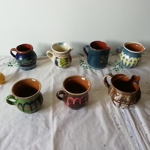 Old farmer's jugs, Milk pitchers made of ceramics, Handmade hand-painted folk primitive vessel, Rustic terracotta pottery, Country house