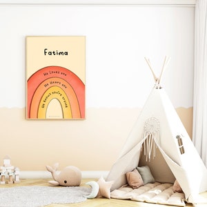 May include: A framed print with a rainbow design and the text "Fatima" at the top. The rainbow has the words "He loves you", "He hears you", and "He knows you're trying" written on it. The print is hanging on a white wall above a beige rug. A white teepee tent with a dreamcatcher hanging from the top is in the lower right corner of the image.