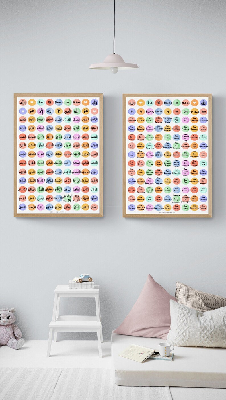 May include: Two framed posters with colorful circles containing the 99 names of Allah in Arabic and English. The posters are hanging on a white wall with a white step stool and a pink pillow on a white couch in the foreground.