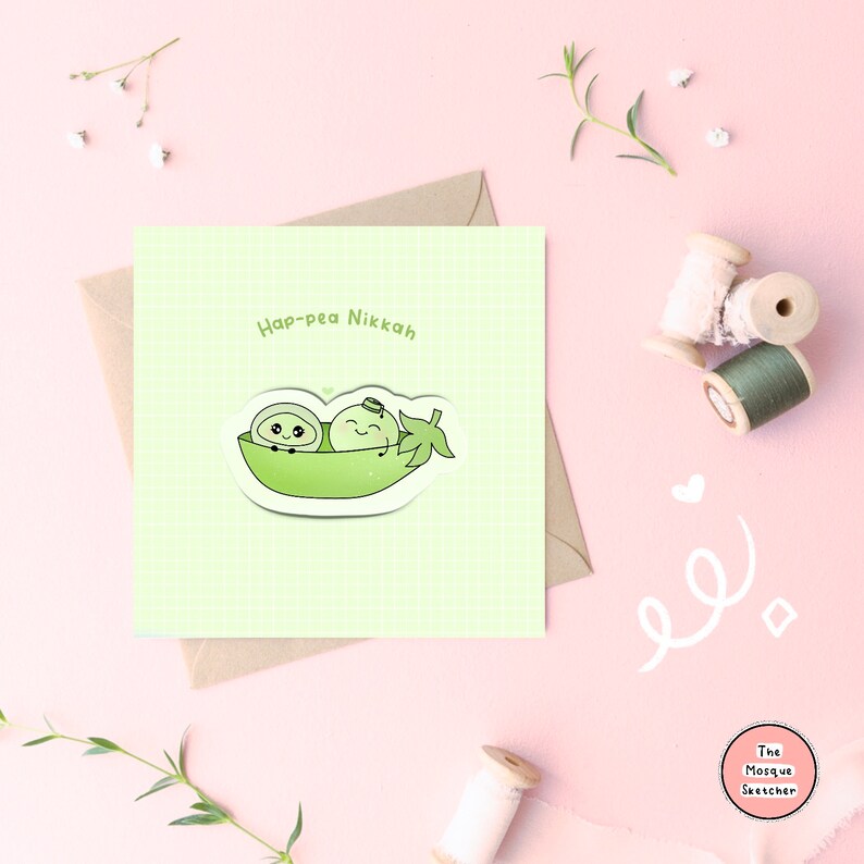 May include: A light green card with the text "Hap-pea Nikkah" and a cartoon illustration of two peas in a pea pod. The peas are smiling and have eyes and mouths. The card is on a light pink background.