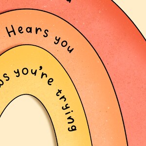May include: A rainbow-colored illustration with the text "Loves you", "Hears you", and "Knows you're trying" written in black.