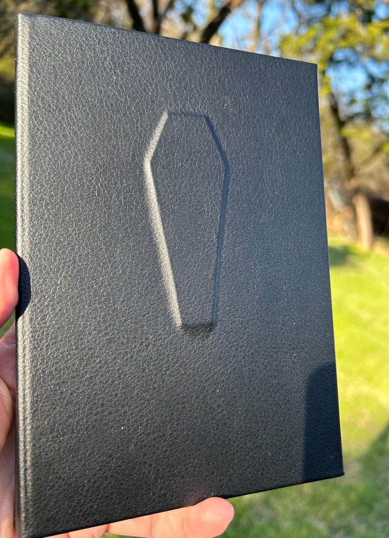 This handmade coffin-style journal embodies bold gothic minimalism; subtle, striking, and unapologetically dark.