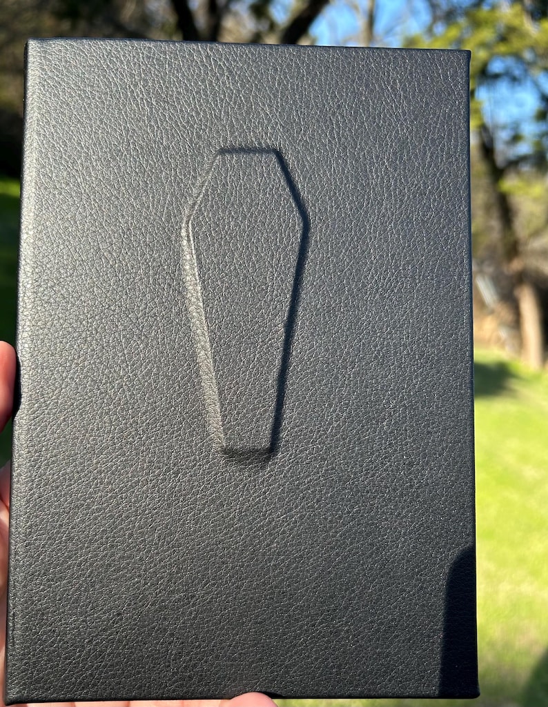 This handmade coffin-style journal embodies bold gothic minimalism; subtle, striking, and unapologetically dark.