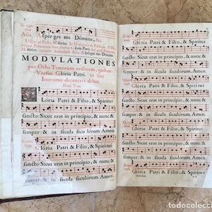 May include: A page from an old book with musical notation and the text "Gloria Patri & Filio, & Spiritui" repeated several times. The text is in Latin and the musical notation is in black ink.