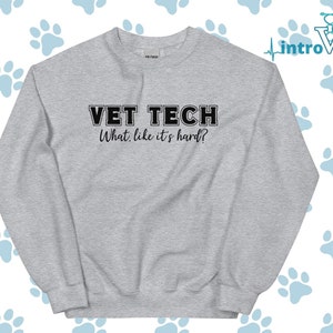 May include: Gray sweatshirt with the text "VET TECH What, like it's hard?" in black.