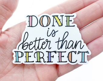 May include: White sticker with the text "DONE is better than PERFECT" in black script. The letters are outlined in rainbow colors.