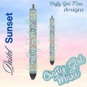 May include: Pastel Sunset pen with a hexagonal pattern in pastel colors. The pen has a silver tip and a black ink cartridge. The image also includes the text "Crafty Girl Maxi designs".