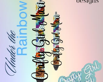May include: Two colorful pens with a rainbow mosaic design. The pens are labeled "Crafty Girl Maxi" and the text "Under the Rainbow" is visible in the background.