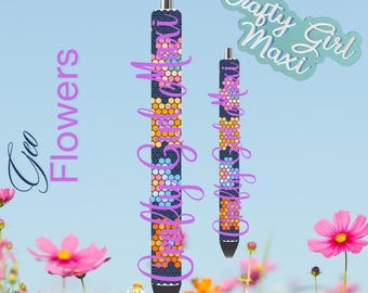 May include: Two black pens with colorful geometric patterns. The patterns are made of small squares in shades of blue, pink, orange, and yellow. The pens are labeled "Crafty Girl Maxi".