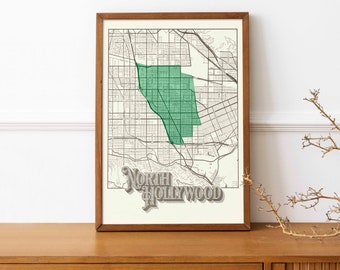 May include: Framed map print of North Hollywood, California, with a green highlighted area. The map is in black and white with a vintage style, set in a wooden frame. The words "North Hollywood" are in a 3D font.
