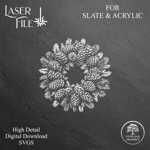 May include: A white line drawing of a pine cone wreath on a black background. The text "LASER FILE" and "FOR SLATE & ACRYLIC" is at the top of the image. The text "High Detail Digital Download SVGs" is at the bottom left of the image. The text "VIVID OAK GRAPHICS" is at the bottom right of the image.