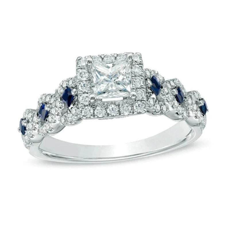 May include: A silver engagement ring with a square-cut diamond center stone surrounded by a halo of smaller diamonds. The band is twisted and features blue sapphires.