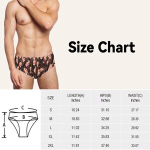 Op de afbeelding: Maattabel voor zwembroeken met metingen in inches voor lengte, heupen en taille. De maten omvatten S, M, L, XL en 2XL.