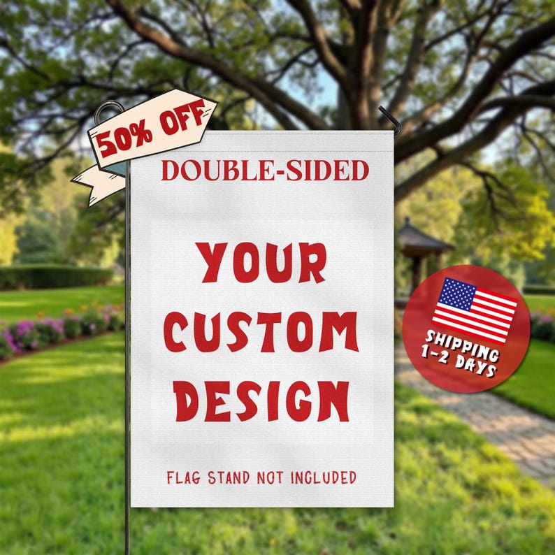 May include: A white, double-sided garden flag with the text "YOUR CUSTOM DESIGN" in red. A banner above reads "50% OFF". The flag is displayed on a metal pole in a garden setting. The text "FLAG STAND NOT INCLUDED" is at the bottom.