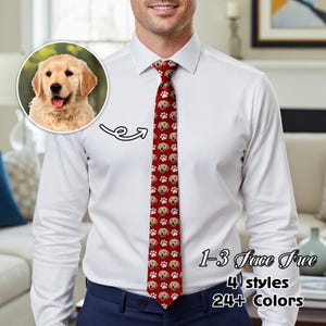 May include: A red tie with a pattern of golden retriever faces and paw prints. The tie is worn with a white dress shirt. The image also includes a graphic with the text "1-3 Face Free, 4 styles, 24+ Colors."