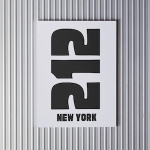 May include: Black and white graphic print of the number 212 with the text "NEW YORK" below it.