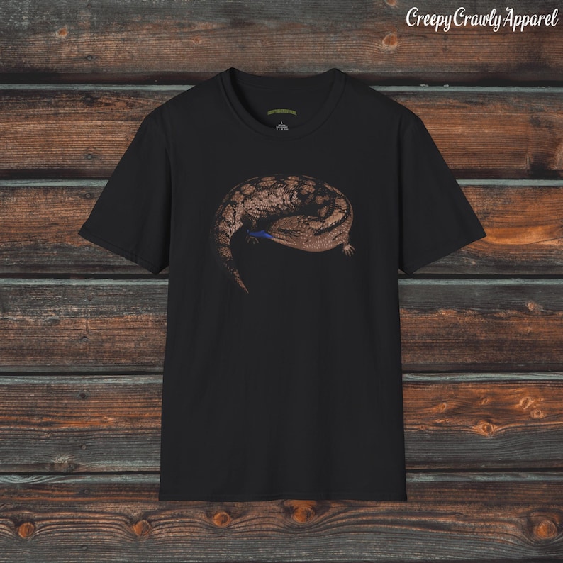 May include: Black t-shirt with a graphic print of a brown and black lizard curled up on a black background. The text "Creepy Crawly Apparel" is printed in white at the top of the image.
