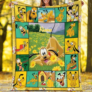 May include: A yellow Pluto-themed blanket featuring various images of Pluto in different poses, set against yellow and green backgrounds. The blanket has a border with paw prints and bone designs. The word "Name" is visible on the blanket.