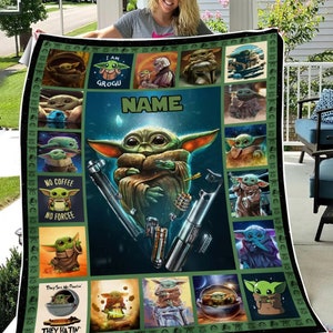 May include: A green and brown Grogu-themed blanket featuring various images of Grogu, lightsabers, and the text "I AM GROGU", "NO COFFEE NO FORCEE", and "THEY SEE ME FLOATIN' THEY HATIN'". The blanket has a dark green border.
