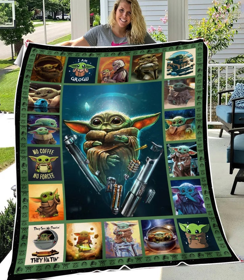 May include: A green and brown Grogu-themed blanket featuring multiple images of Grogu, lightsabers, and text that reads "I AM GROGU", "NO COFFEE NO FORCEE", and "They See Me Floatin' They Hatin'". The blanket has a dark green border.