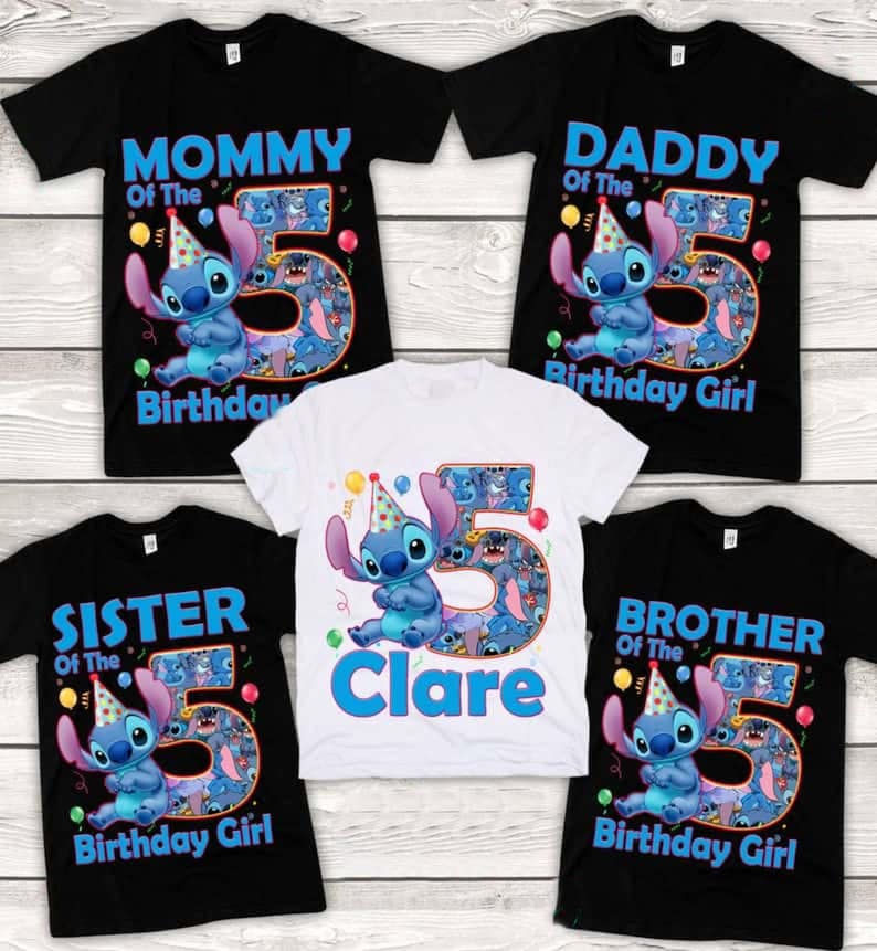 May include: Five t-shirts, black and white, with a cartoon character and the number 5. The shirts read "Mommy", "Daddy", "Sister", "Brother", and "Clare". The character is blue with a party hat.