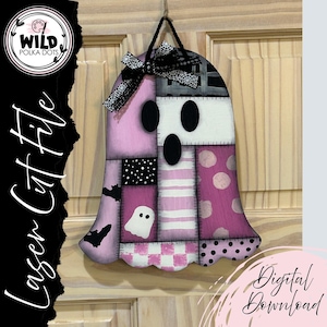 May include: A patchwork ghost-shaped wooden decoration with a black bow and string for hanging. The ghost features pink, white, and black patterned sections, including polka dots, stripes, and a checkered pattern. The text "Laser Cut File" and "Digital Download" are visible.