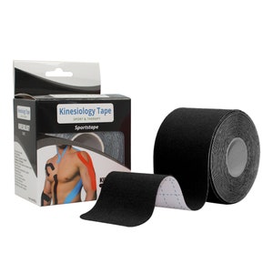 May include: Black kinesiology tape roll with a white label that reads "Kinesiology Tape Sport & Therapy Sports Tape". The tape is rolled up and a portion of the tape is unrolled, showing the black, textured surface.