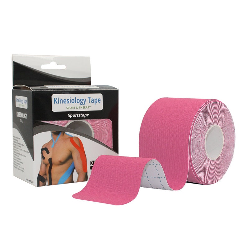 May include: Pink kinesiology tape roll with a white core. The tape is packaged in a box with the text "Kinesiology Tape Sport & Therapy Sportstape".