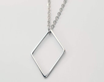 Silver stainless steel rhombus pendant for women of own design and handmade.